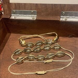 Set of three shell pull bracelets